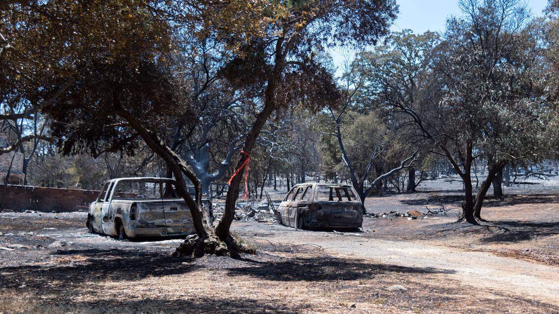 Burned cars sit near a driveway next to rubble from a destroyed home in Oroville on Wednesday, July 3, 2024. Better evacuation planning can help save community lives.