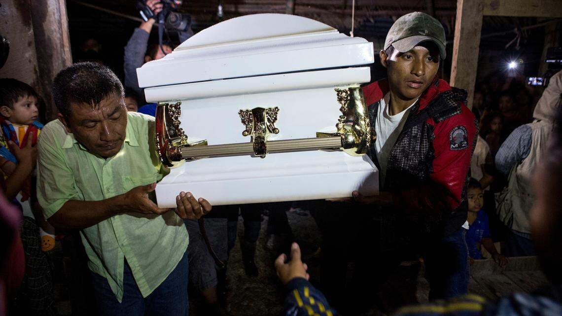 Neighbors carry the coffin that contain the remains of 7-year-old Jakelin Caal Maquin into her grandparent’s home in San Antonio Secortez, Guatemala, Monday, Dec. 24, 2018. The body of a 7-year-old girl who died while in the custody of the U.S. Border Patrol was handed over to family members in her native Guatemala on Monday for a last goodbye. (AP Photo/ Oliver de Ros)
