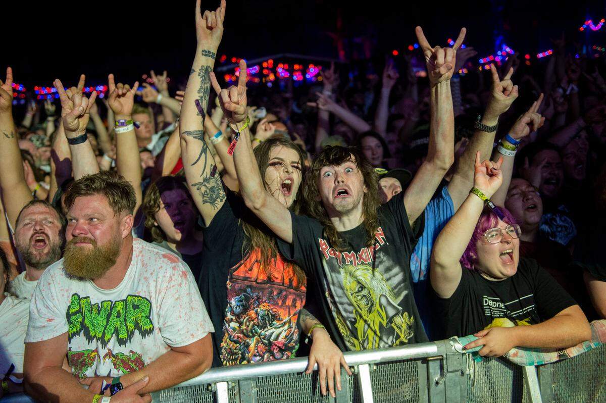 Fans of Gwar cheer on their performance at the Aftershock Festival on Friday night.