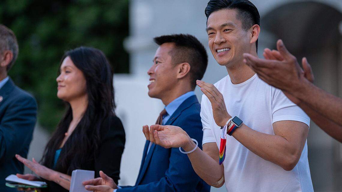 Assemblymember Evan Low, right, spoke during the lighting ceremony to illuminate the State Capitol in rainbow colors to celebrate PRIDE Month on Monday, June 21, 2021, in Sacramento.