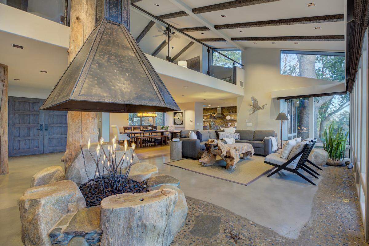 The indoor fire pit was designed to resemble a bonfire at the river’s edge.