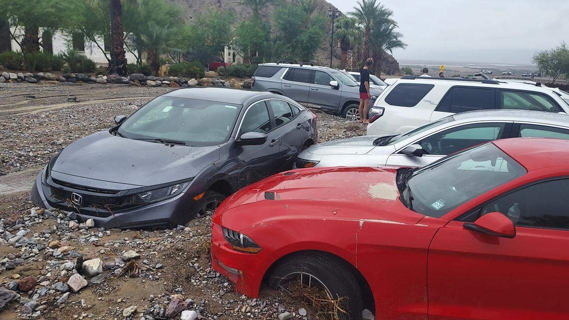 Cars are stuck in mud and debris from flash flooding at The Inn at Death Valley in Death Valley National Park, Calif., Friday, Aug. 5, 2022. Heavy rainfall triggered flash flooding that closed several roads in Death Valley National Park on Friday near the California-Nevada line. The National Weather Service reported that all park roads had been closed after 1 to 2 inches of rain fell in a short amount of time.