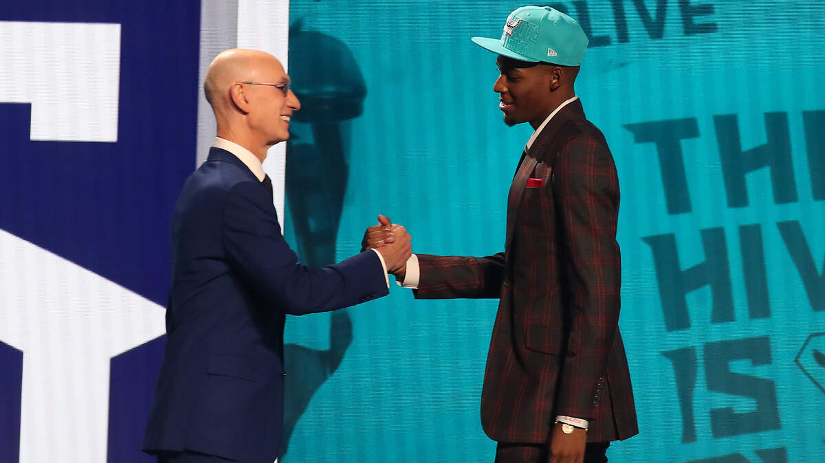 Alabama’s Brandon Miller is greeted by NBA commissioner Adam Silver after being selected second by the Charlotte Hornets in the first round of the 2023 NBA Draft on June 22, 2023, at Barclays Center in Brooklyn, New York.