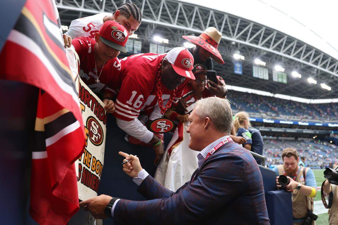 SEATTLE, WASHINGTON - SEPTEMBER 07: General manager John Lynch of the San Francisco 49ers signs autographs after defeating the Seattle Seahawks during the game at Lumen Field on September 07, 2025 in Seattle, Washington. (Photo by Amanda Loman/Getty Images)