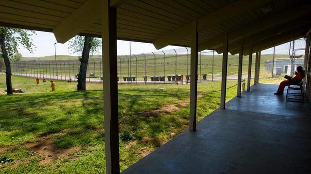 Juvenile offenders work in the yard at the county Boys Ranch in 2009. The program closed in 2010 because of budget cuts.
