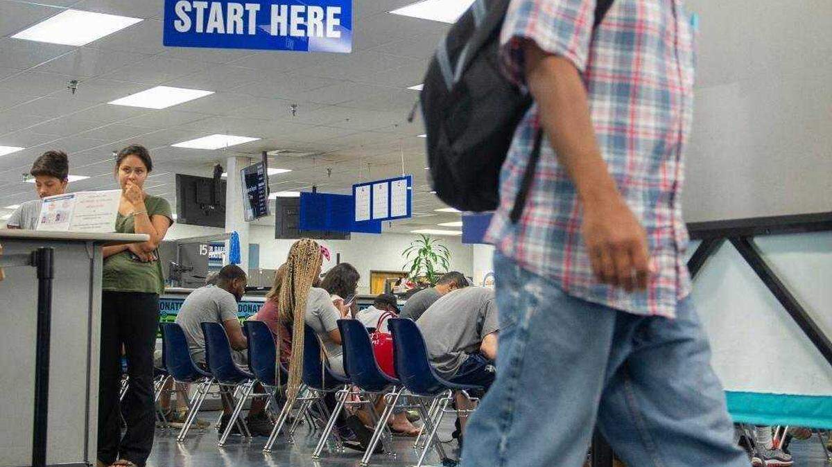 People wait for their numbers to be called at a California DMV office in Sacramento on June 14, 2018. A statewide computer outage on Tuesday, May 26, 2026, disrupted DMV services.