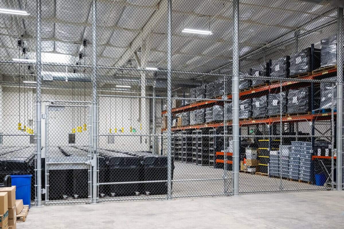 The Dominion Voting Systems machines, photographed in July, are kept in a caged area with a separate alarm system from the rest of the building at the Placer County Elections Office.