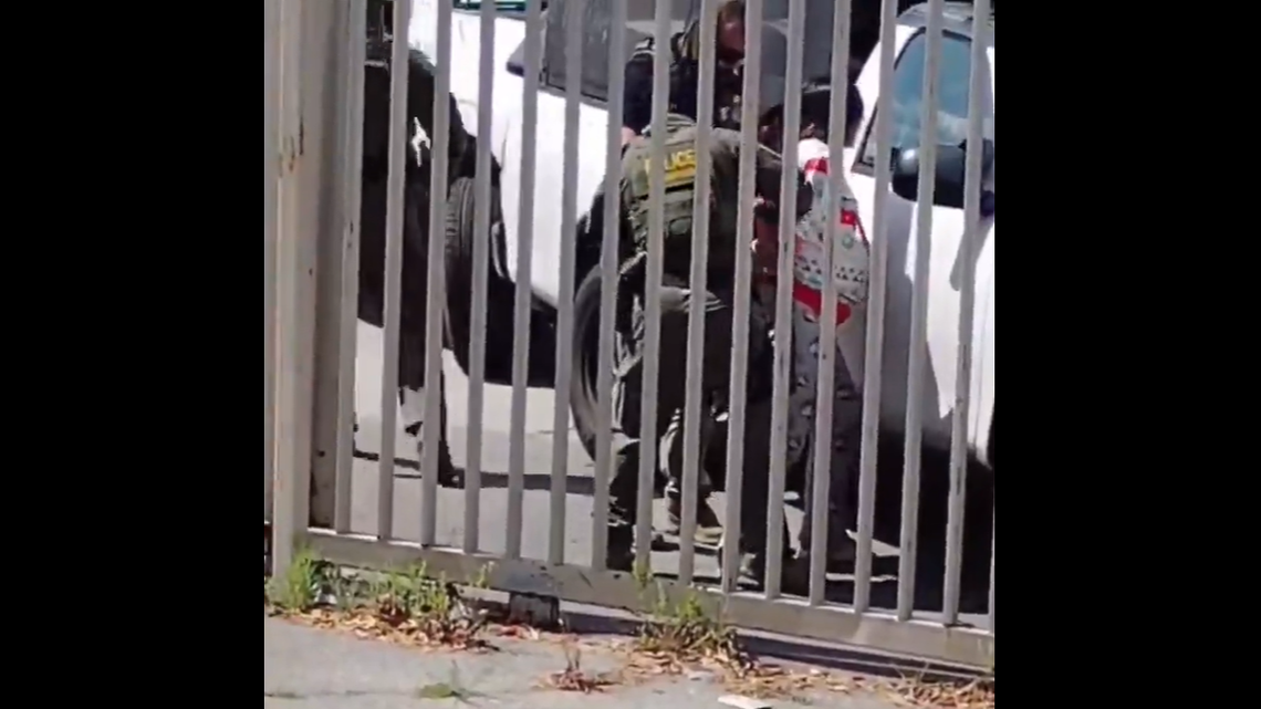 Image from footage of Cary Lopez Alvarado being detained.