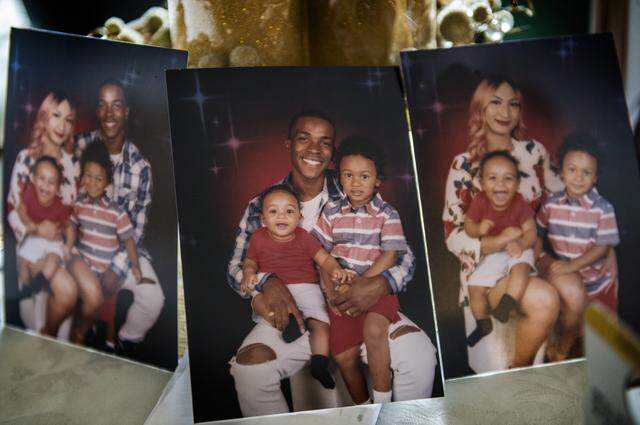Photographs of Stephon Clark, his girlfriend Salena Manni, sons Aiden Clark, 3, and Cairo Clark, 1, are displayed on a table inside his grandmother Sequita Thompson's home.