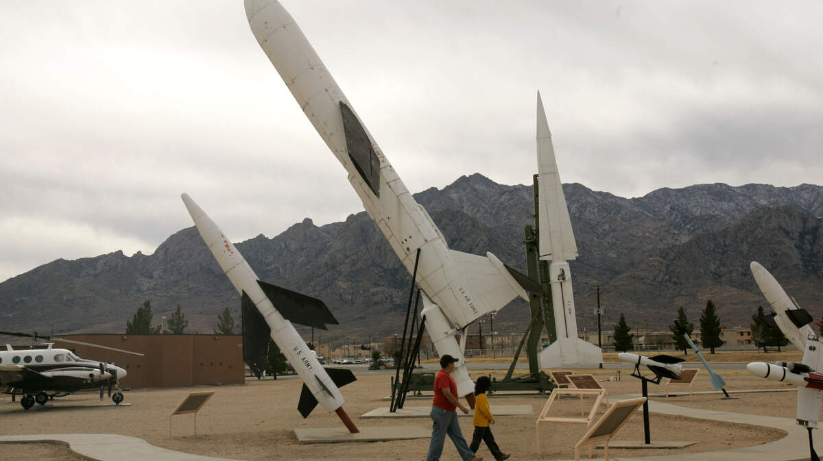 George Chacon, 12, left, and his brother Josh, 8, tour the rockets on display at the White Sands Missile Range, Friday Dec. 22, 2006 in White Sands Missile Range, N.M. The base is one of three places where NASA could land the Space Shuttle Discovery. (AP Photo/Rob Carr)