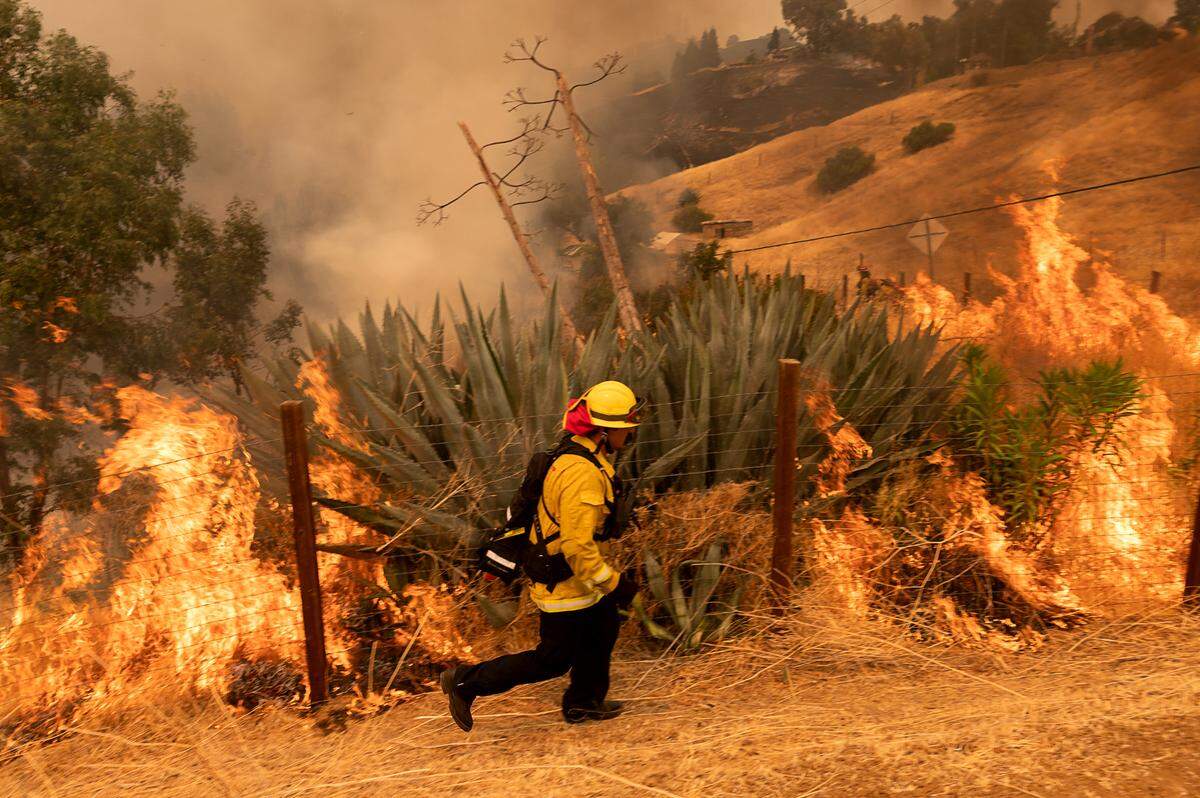 Huntington Beach fire department members battle the LNU Lightning Complex fires on Serenity Hills Road on Wednesday, Aug 19, 2020, in Vacaville.