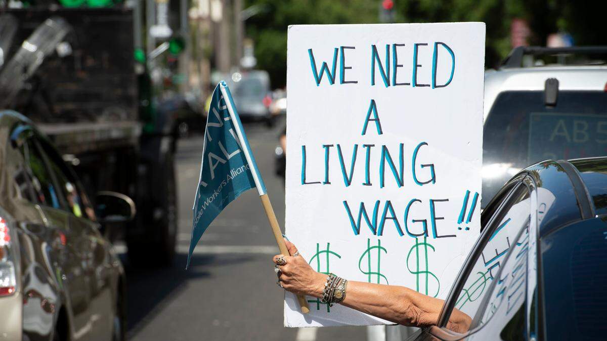 A ride share driver lobbies for better wages during a 2019 rally in Sacramento. Prop. 22, which deals with employment status of app drivers, is the most expensive ballot measure in U.S. history.