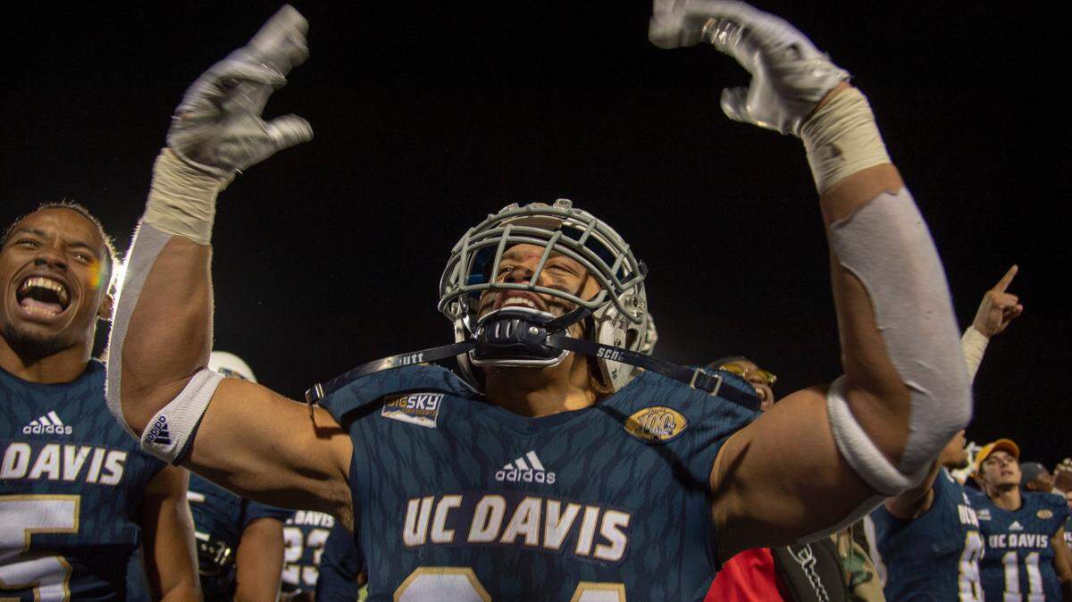 Mason Moe and the UC Davis football team celebrates a playoff victory over Northern Iowa on Dec. 1 in Davis. The Aggies will face Eastern Washington on Saturday in Cheney, Wash.