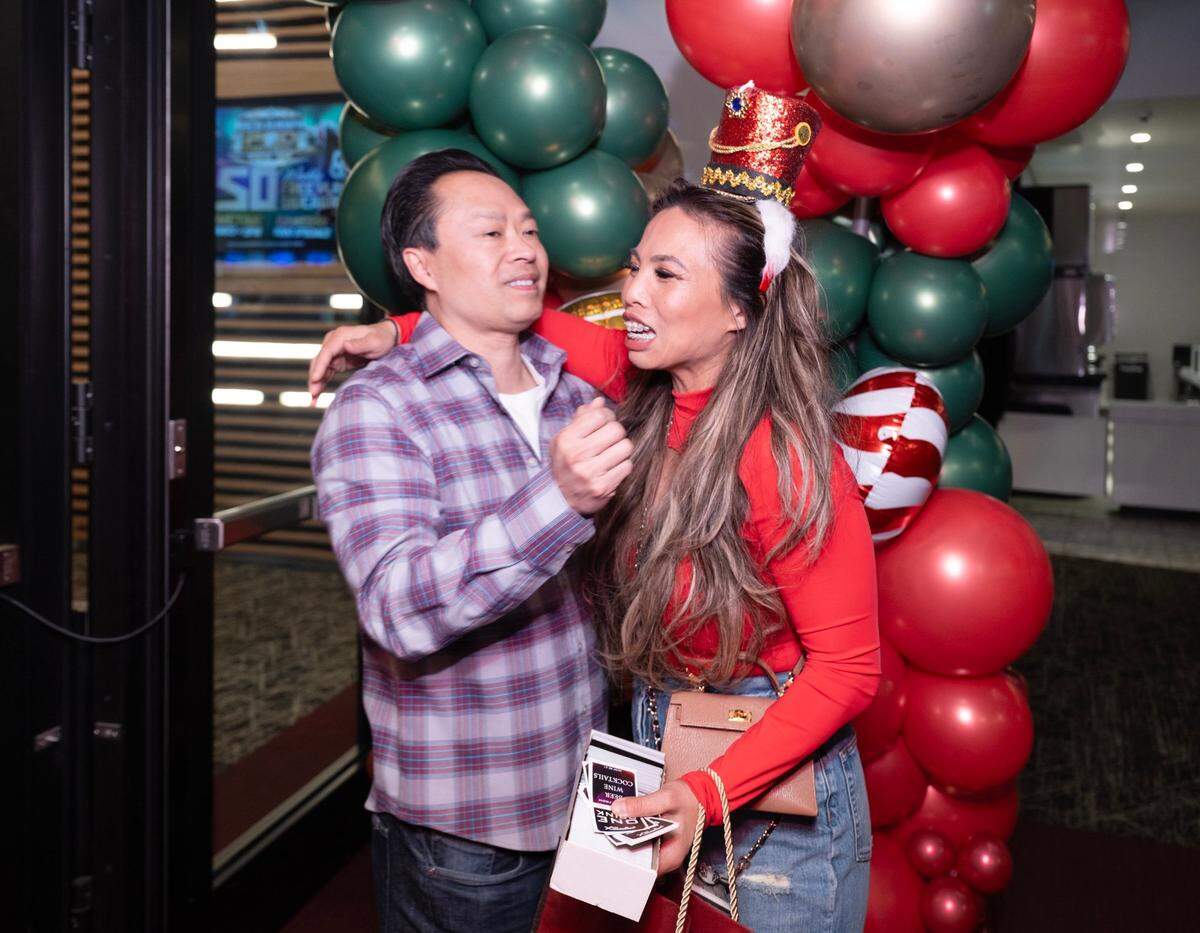 Attorney Anh Phoong embraces Sacramento County District Attorney Thien Ho as he arrives at her law firm’s annual Christmas Party earlier this month at The Apex at Red Hawk casino.