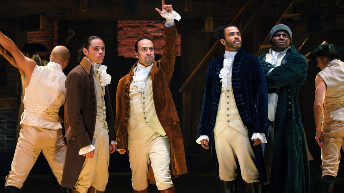 Anthony Ramos is John Laurens, Lin-Manuel Miranda is Alexander Hamilton, Daveed Diggs is the Marquis de Lafayette, and Okieriete Onaodowan is Hercules Mulligan in “Hamilton,” the filmed version of the original Broadway production.