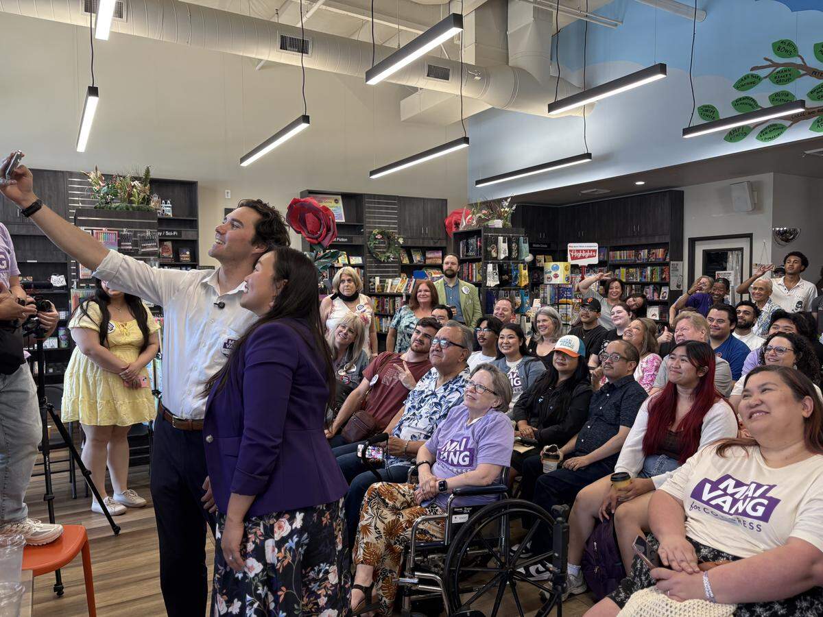 Leaders We Deserve founder David Hogg and Sacramento City Council member Mai Vang take a selfie with supporters Saturday at A Seat at the Table Books in Elk Grove. They held a Q&A as Vang runs for Congress in California’s 7th District.