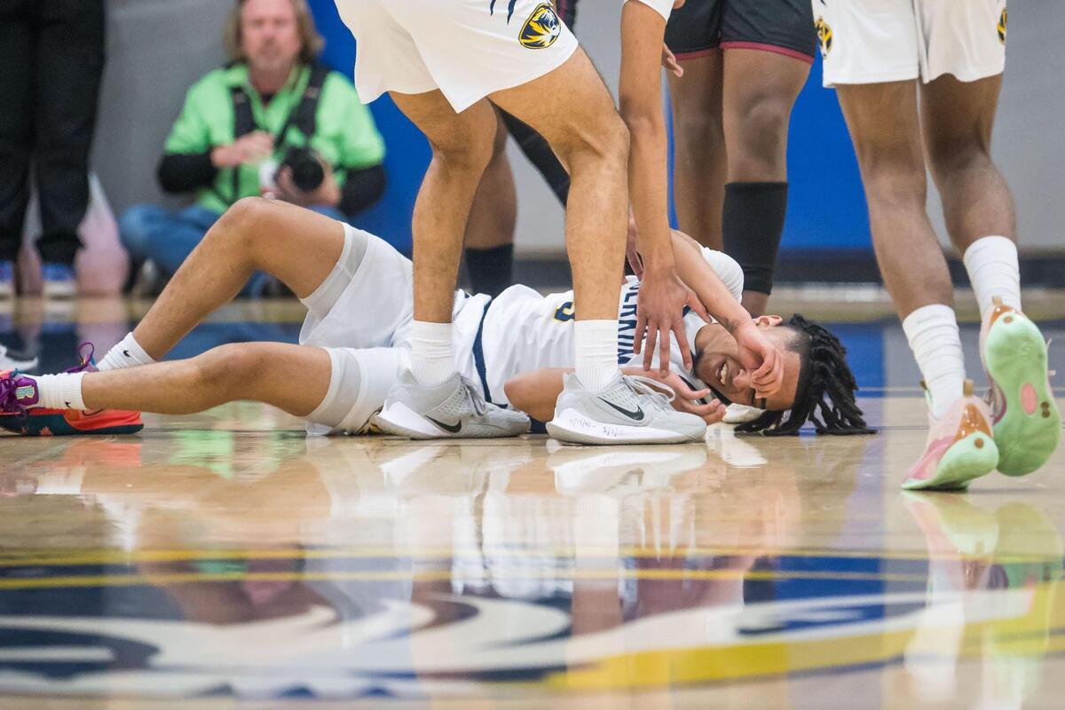 Inderkum Tiger guard Jermaine Haliburton (3) goes down with a chipped tooth during the first quarter against Laguna Creek during the high school boys basketball CIF Sac-Joaquin Section playoff game Friday, Feb. 17, 2023, at Inderkum High School in Natomas. Inderkum won 69-55 to advance to the Division I section semifinals.