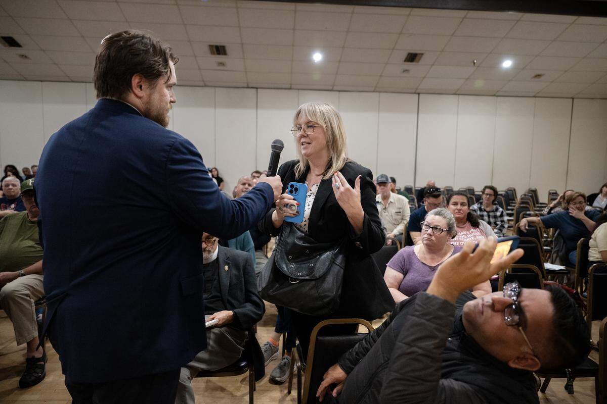 Erica Lee asks Rep. Doris Matsui a question during a town hall meeting at the Elks Lodge in Sacramento on Thursday.