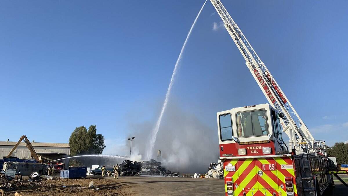 Firefighters work on a blaze in Rancho Cordova on Monday.