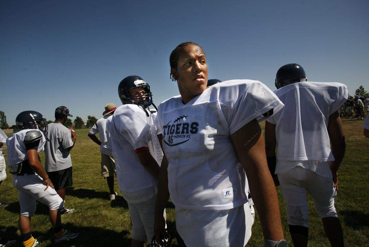 Lineman Greg Grimes of Inderkum looks back toward friends as he stands on the sidelines at a summer camp at Inderkum High in 2007. Grimes died after being shot outside a nightclub at 16th and L streets in downtown Sacramento early Monday.