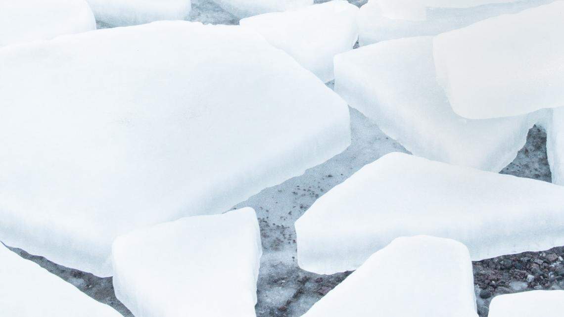 Two men are missing after their ATV fell through ice while trying to save another ATV rider on a Wyoming lake, officials say.