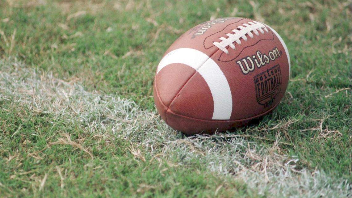 FILE - Pierce College head football coach Carlos Woods is under investigation, accused of charging his players hundreds of dollars a month in rent to live in the team’s locker room and cramming as many as 30 other players into an off-campus apartment.