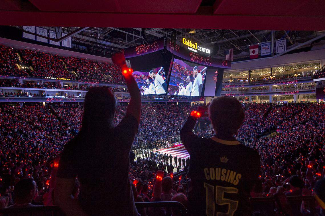 Fans wave colored wristbands during the national anthem at the first game at Golden 1 Center on Oct. 27, 2016, when the Kings hosted the San Antonio Spurs.