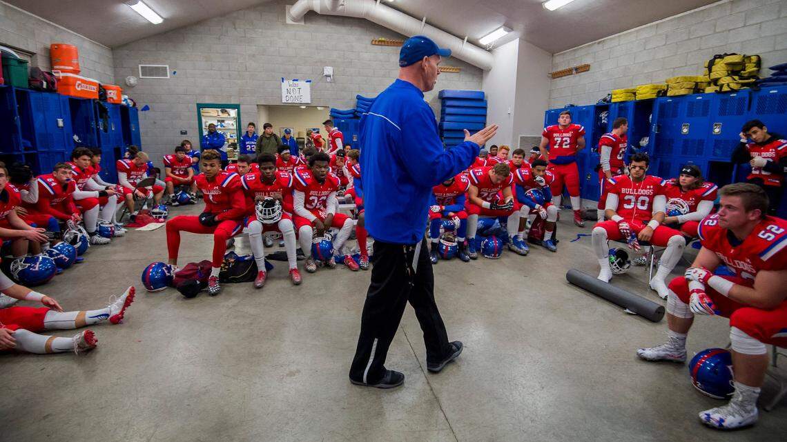 Folsom coach Kris Richardson talks to his team before the Bulldogs host the Central High School Grizzlies in the CIF NorCal Division I-AA title game on Dec. 8, 2017.  Folsom, with 15 returning starters from a 16-0 team, leads the way with 10 players in The Bee’s preseason Top 50, including four of the top seven.
