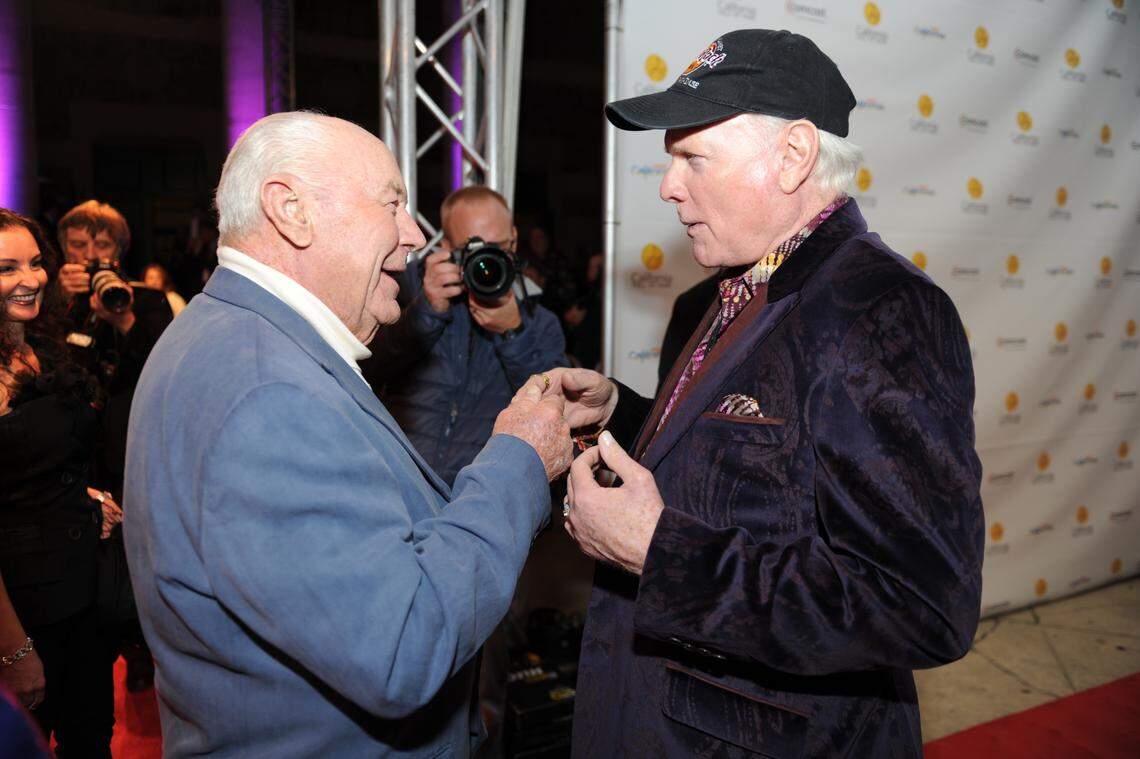 Aviator Chuck Yeager talks with Mike Love of the Beach Boys during Love’s induction to the California Hall of Fame on Dec. 8, 2011. Yeager, who was inducted in 2009, was in attendance as Gov. Jerry Brown and first lady Anne Gust Brown hosted the ceremony, which also added astronaut Buzz Aldrin to the hall.