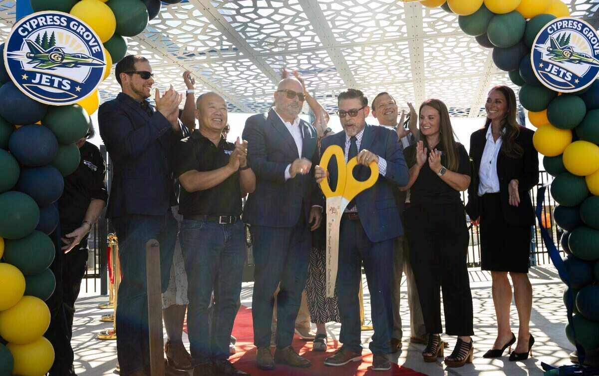 Administrative staff and contributors towards the newly constructed Cypress Grove Elementary School participate in a ribbon cutting ceremony during the school’s grand opening in Rancho Cordova on Tuesday.