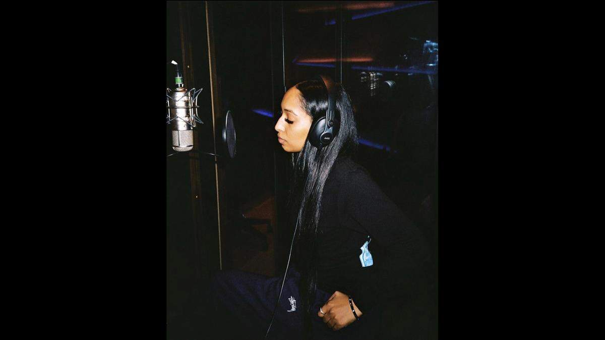 Allyn, R&B artist, during a recording session at the studio.