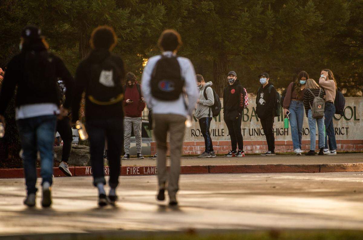 Students at Granite Bay High School walk to school after returning to campus from winter break in 2021.