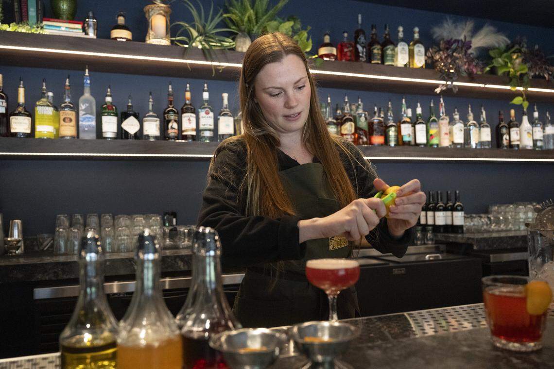 Lauren Holland prepares All Pulp, No Fiction, a cocktail served at Studio 24, a new VIP section at music venue Channel 24, in Sacramento on Tuesday, April 21, 2026.
