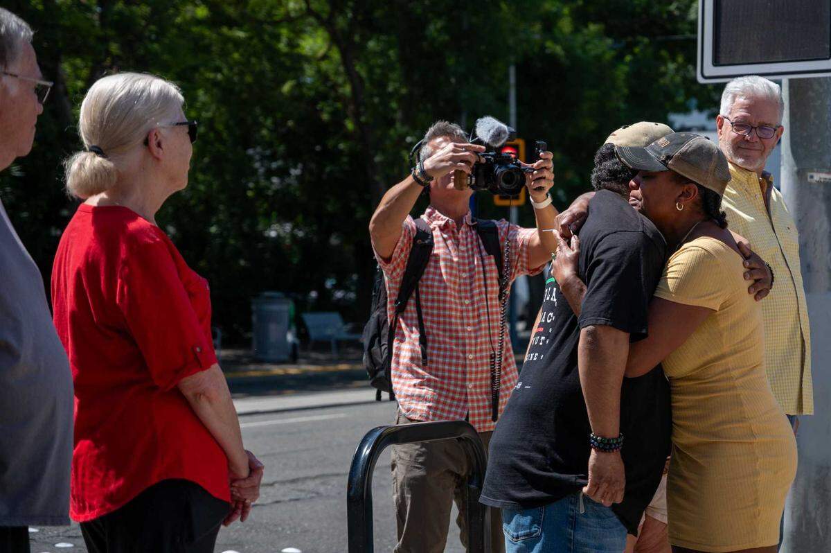 Owner N’Gina Guyton hugs first customer in line at Jim-Denny’s last day in Sacramento on Wednesday. On Tuesday, she announced the restaurant would close after she received an eviction notice from the building’s owner.