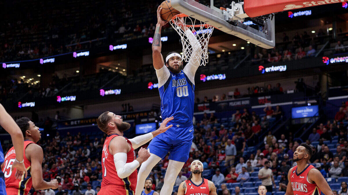 Dallas Mavericks center JaVale McGee (00) dunks the ball against New Orleans Pelicans center Jonas Valanciunas (17) during the first half Oct. 25, 2022, at Smoothie King Center in New Orleans, Louisiana.