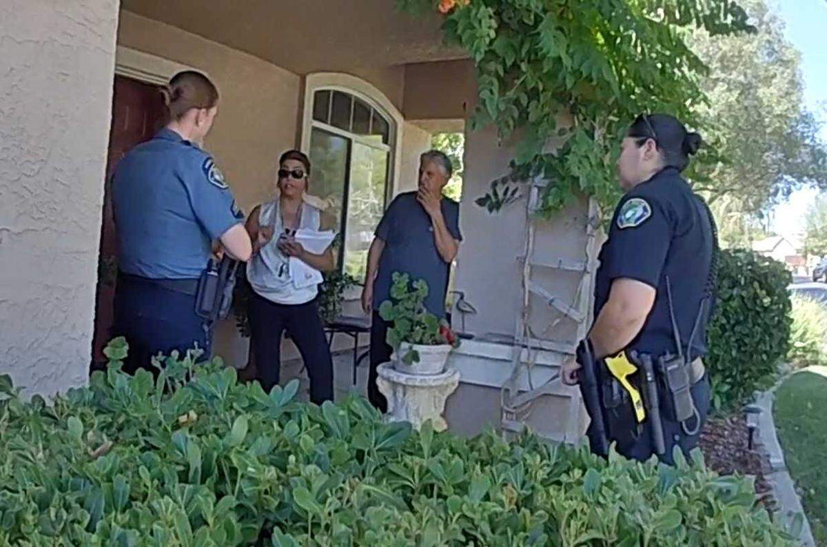 In an image taken from an Elk Grove Police body-worn camera, Faryal Kabir is seen talking with Elk Grove Police officers and an animal control official on July 15, 2022, when authorities came to confiscate her dog, a German shepherd puppy named Zeus. It was during this encounter Zeus bit one of the officers through the officer’s uniform fabric.