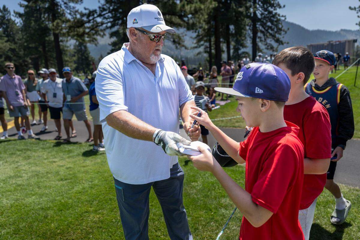 Larry the Cable Guy signs autographs for fans during the final day of the American Century Championship celebrity golf tournament at Edgewood Tahoe Resort in Stateline, Nev., on Sunday, July 13, 2025.