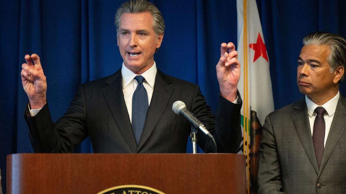 Gov. Gavin Newsom, joined by state Attorney General Rob Bonta, makes an air quotes gesture as he talks about “unplanned” refinery maintenance leading to gas price surges – the issue for which he has convened a special session of the Legislature – at a California Department of Justice press conference in Sacramento on Wednesday, Sept. 4, 2024.