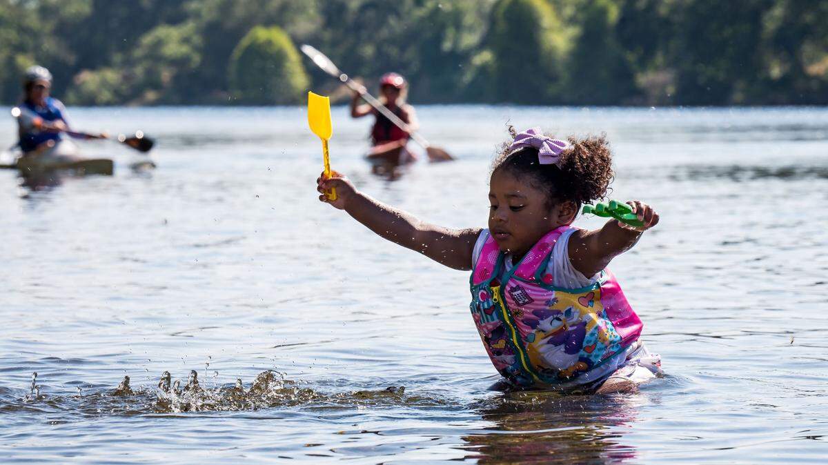 Vivian Vault, 2, of Sacramento, plays in the American River at the Lower Sunrise Recreation Area on Friday, June 30, 2023, in Rancho Cordova.