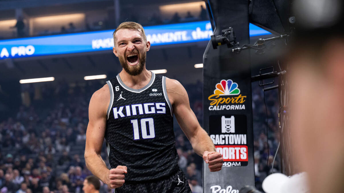 Sacramento Kings center Domantas Sabonis (10) scores two points and is fouled during the first quarter against the San Antonio Spurs at the NBA basketball game Thursday, Nov. 17, 2022, at Golden 1 Center in Sacramento.