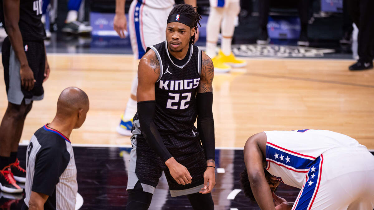 Sacramento Kings center Richaun Holmes (22) reacts as he is called for fouling Philadelphia 76ers center Joel Embiid (21) during the first half of the NBA game Tuesday, Feb. 9, 2021, at Golden 1 Center in Sacramento.