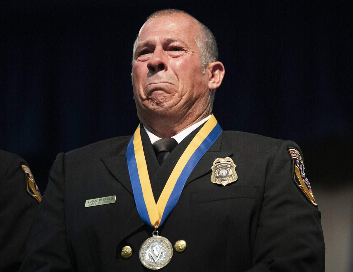 Cal Fire Battalion Chief Chad Fleming gets emotional after receiving the gold Governor’s State Employee Medal of Valor at the California Highway Patrol Academy in West Sacramento on Friday. Fleming saved a man who was engulfed in flames during a wildfire and coordinated emergency air transport under extreme conditions.