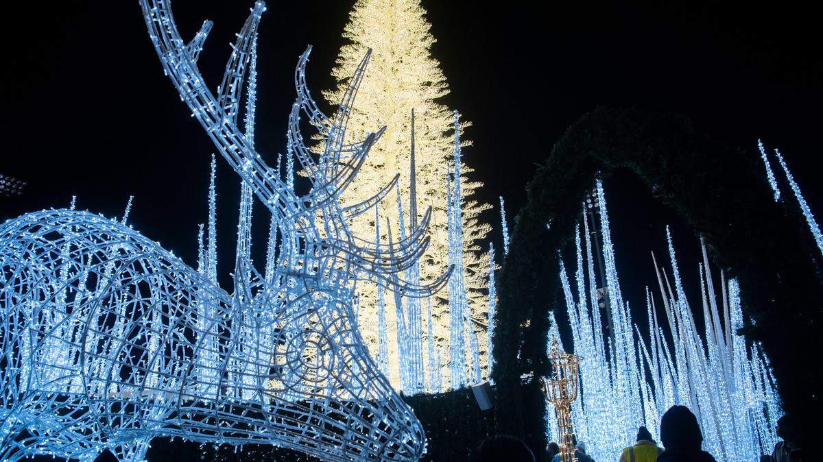 People walk through “Enchanted” a holiday light show at First Horizon Park in Nashville, Tenn., Wednesday, Nov. 23, 2022. This year, it’s coming to San Jose.