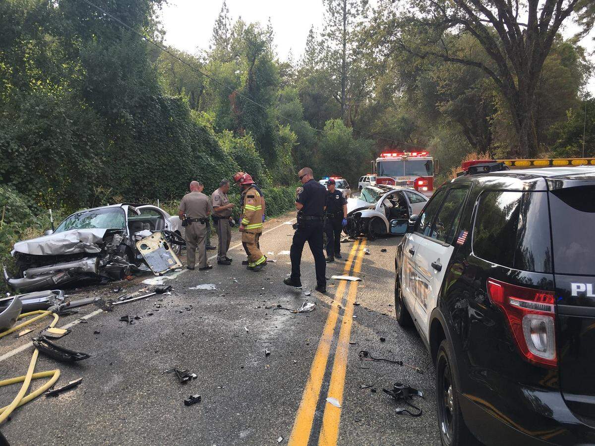 Wrecked cars and auto parts block Green Valley Road in 2017, after a high-speed chase by Placerville police ended in a crash, injuring a suspect and another driver.
