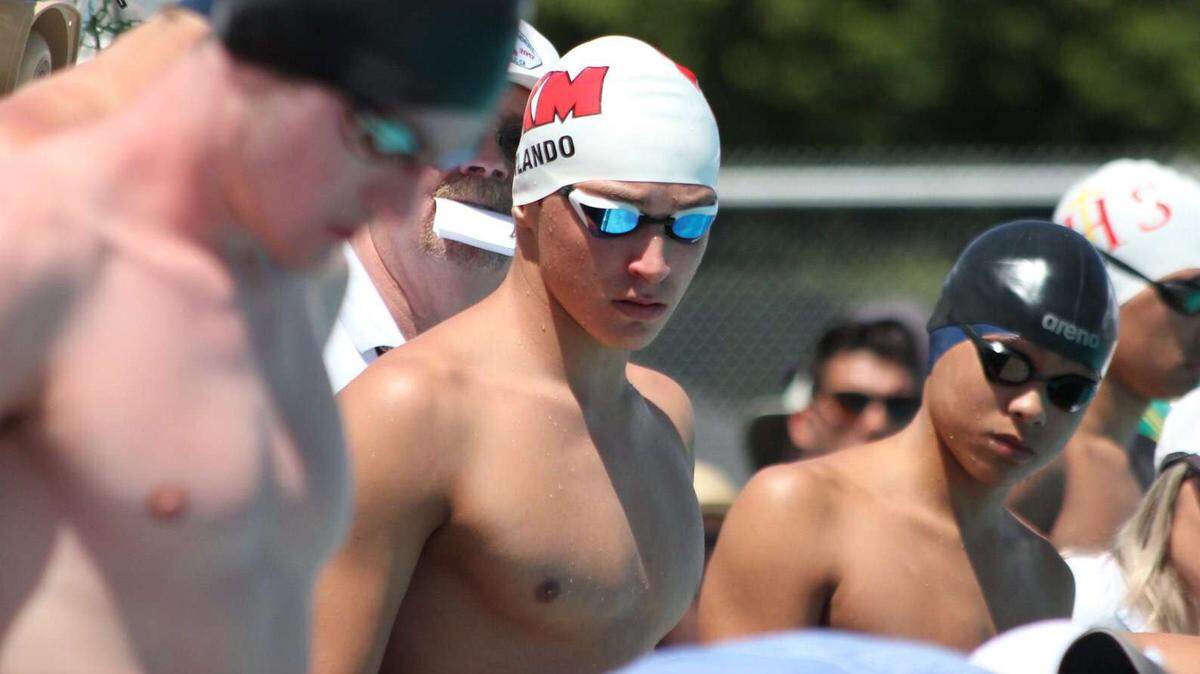Luca Urlando, middle, broke a national public-school record in the 100 butterfly at the Sac-Joaquin Section Championships in 2019 while he was a student at McClatchy High School.