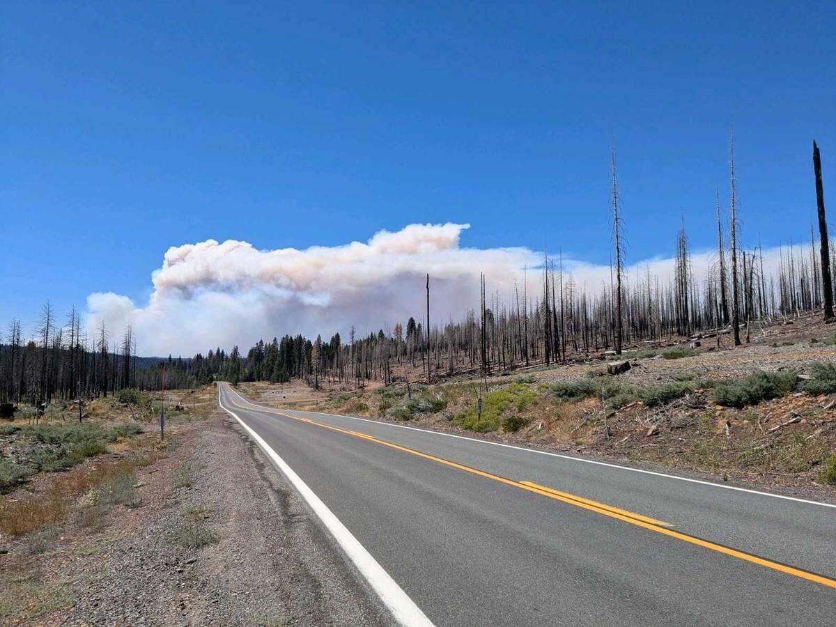 Smoke billows from the Park Fire which continued to burn in Lassen National Forest land in Tehama County, California.