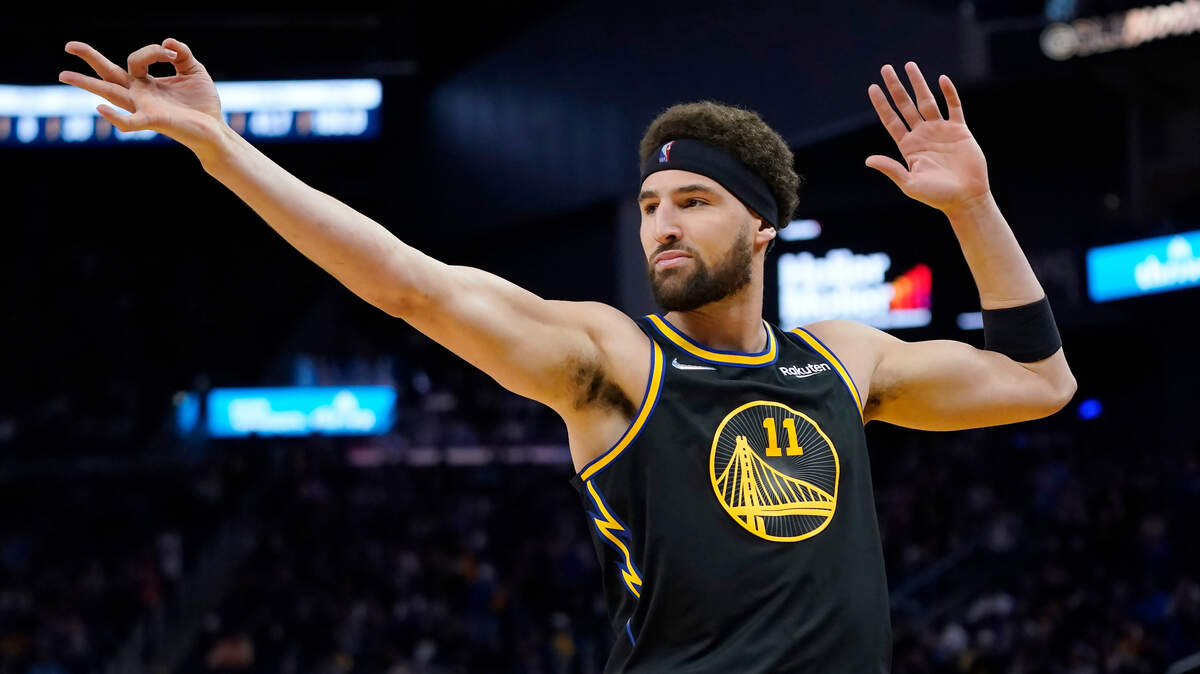 Golden State guard Klay Thompson gestures after making a 3-pointer on April 16, 2022.