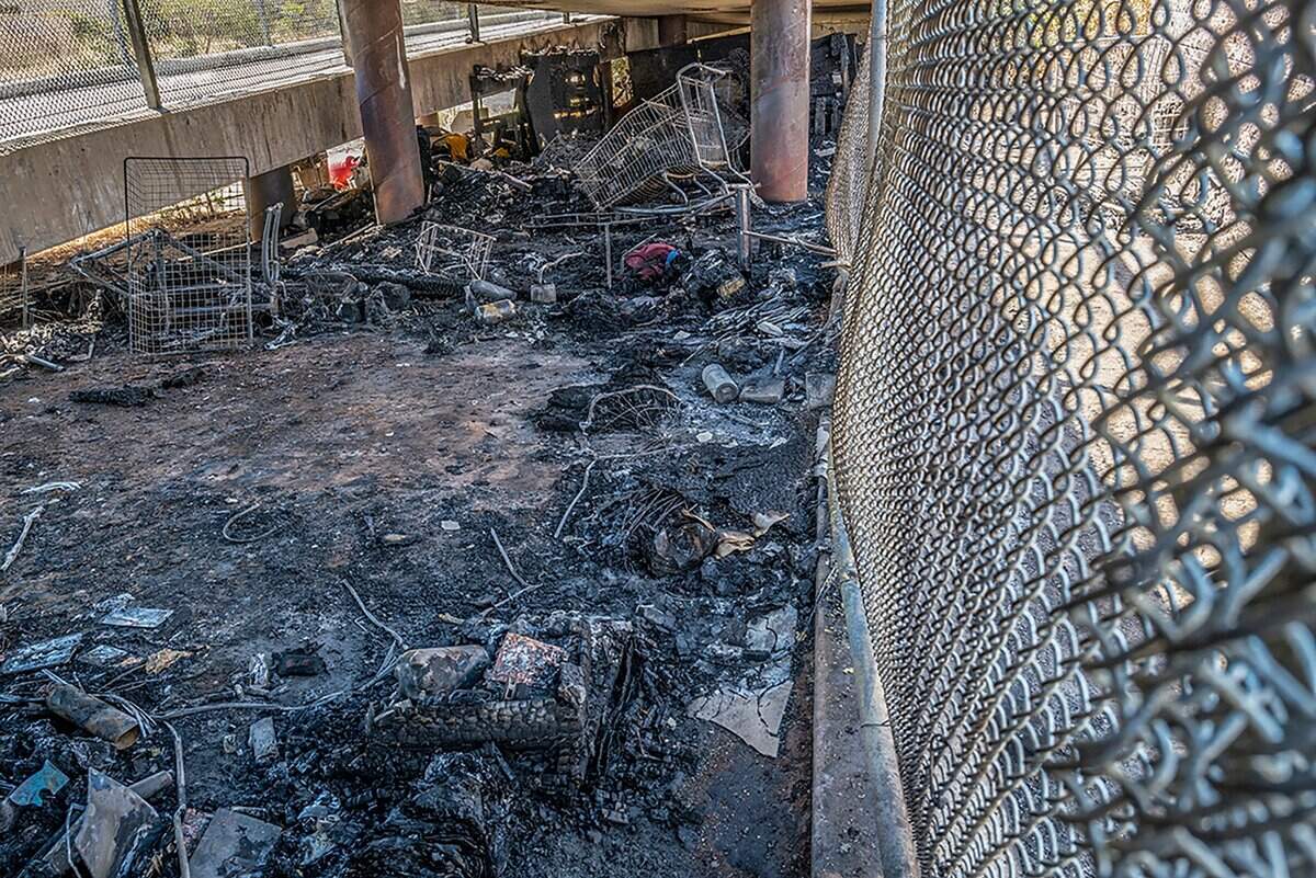 The charred belongings of homeless campers remain under a pedestrian bridge that spans Highway 99 north of Elk Grove Boulevard. The city closed the bridge for a few days until inspectors determined that it was safe to reopen.