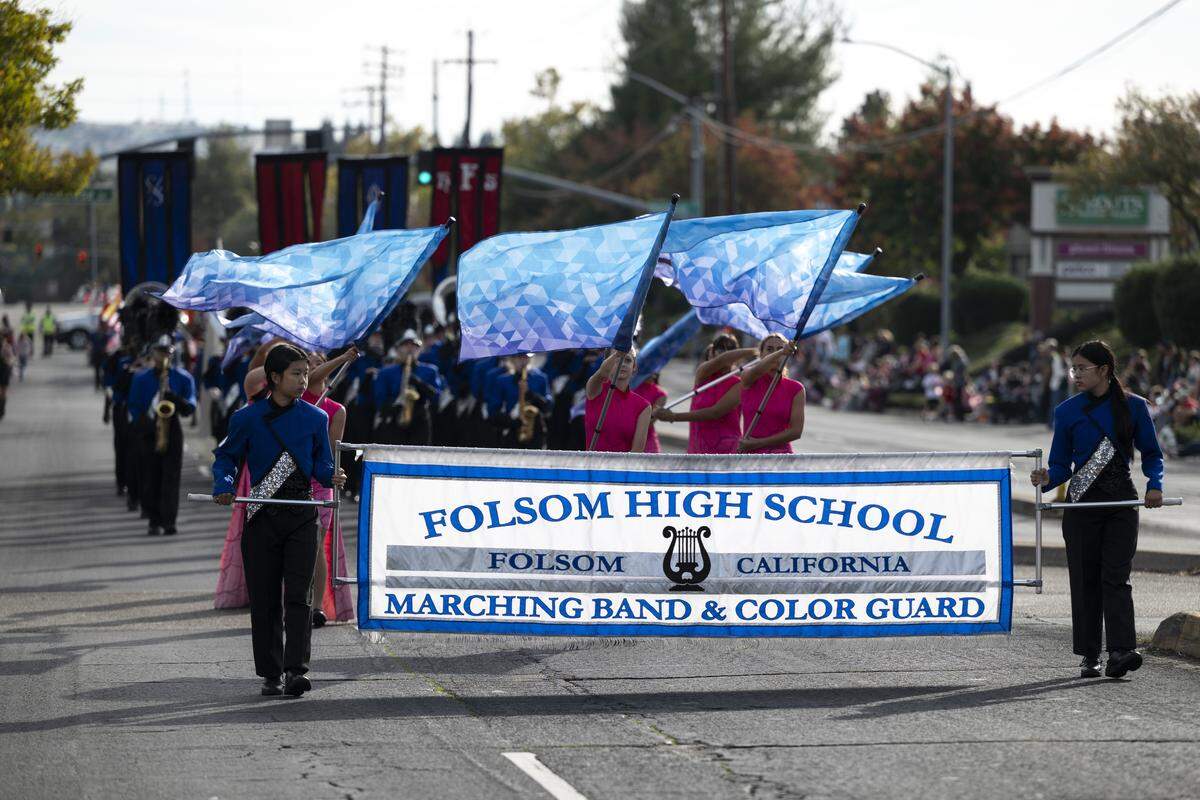 Folsom High School’s marching band and color guard marches during a Veterans Day parade in Folsom on Tuesday, Nov. 11, 2025.