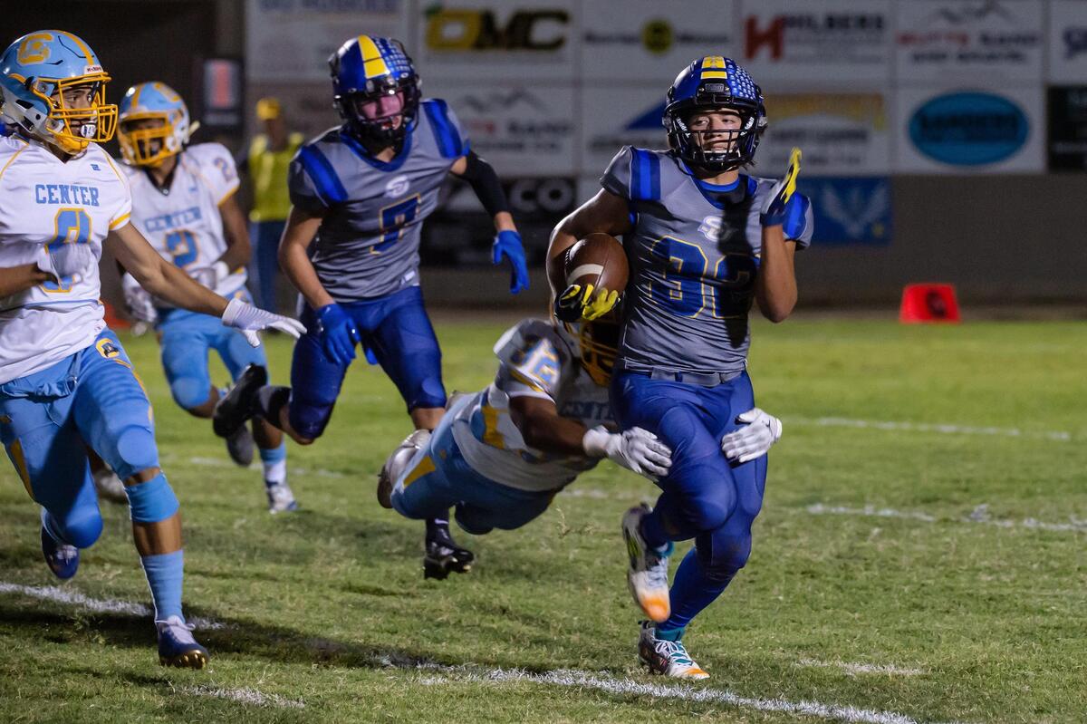 Sutter’s Dylan Humes (32) runs the ball for 21 yards during the second quarter in the game Friday at Sutter High School. The Huskies won 23-20 in overtime.